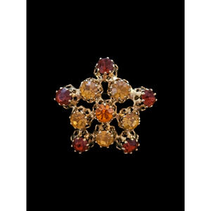 Vintage Made in Austria Gold Tone Amber Crystal Rhinestone Star Brooch